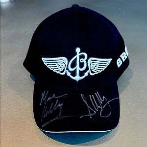 Black Breitling Baseball Cap signed by Astronauts Scott & Mark Kelly